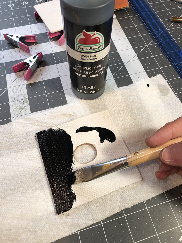 paint the canvas base with black paint